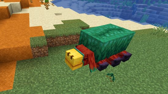 Minecraft mobs: The Minecraft sniffer lies on the ground, having recovered a Torchflower seed